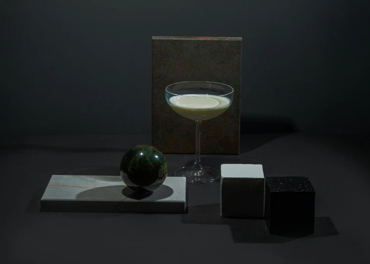 a glass filled with liquid sitting on top of a table, a still life, inspired by Ndoc Martini, suprematism, marble stone, detailed product image, moonlit, light source from the left