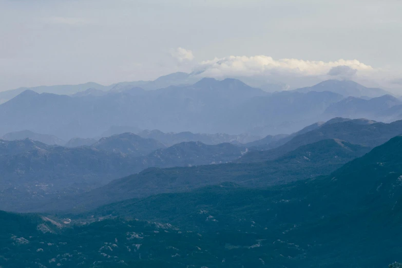 a view of the mountains from the top of a hill, by Alexis Grimou, pexels contest winner, les nabis, traditional corsican, telephoto long distance shot, slightly pixelated, view from helicopter