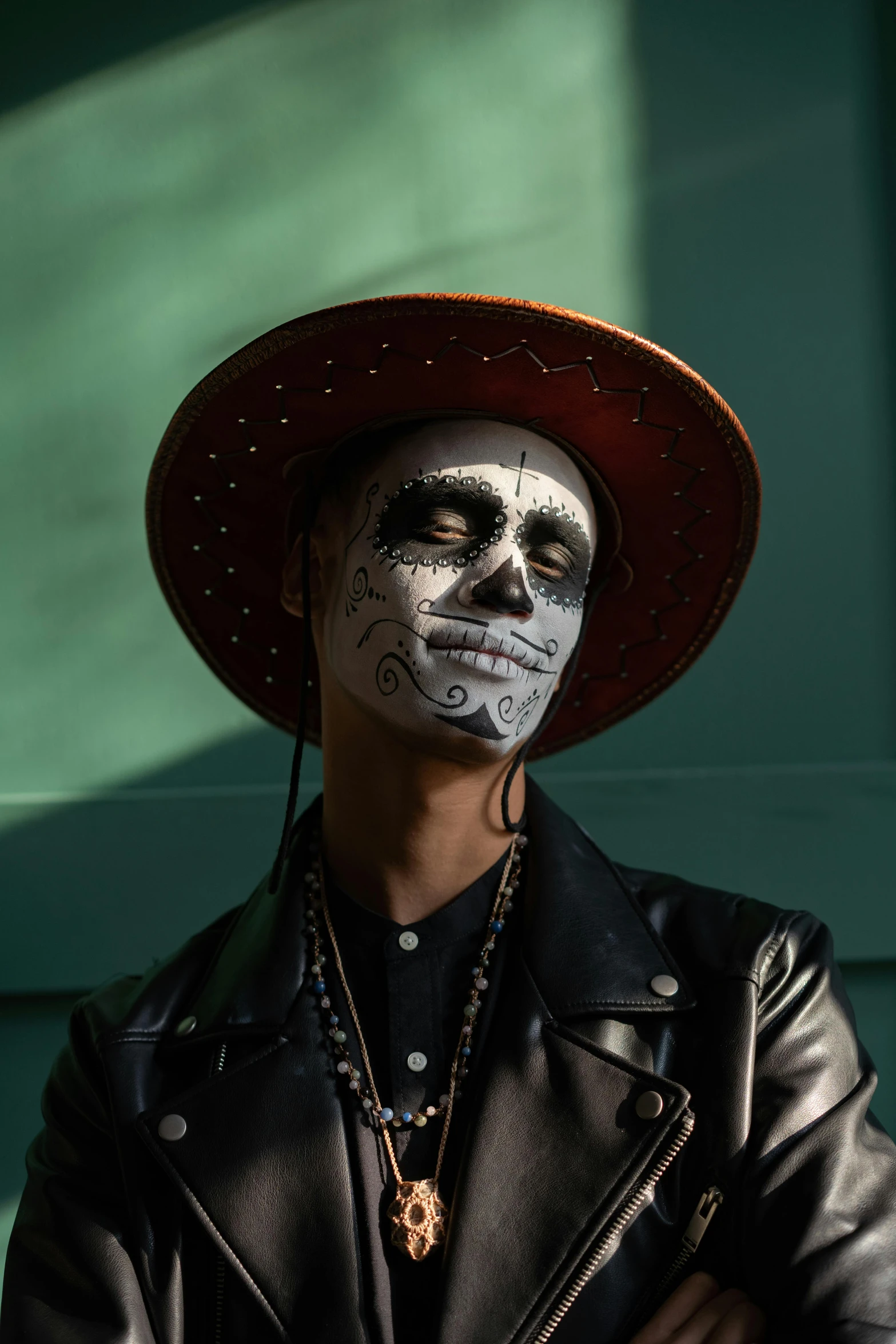 a man in day of the dead makeup poses for a picture, an album cover, pexels contest winner, black hat, young spanish man, getty images proshot, illustration:.4