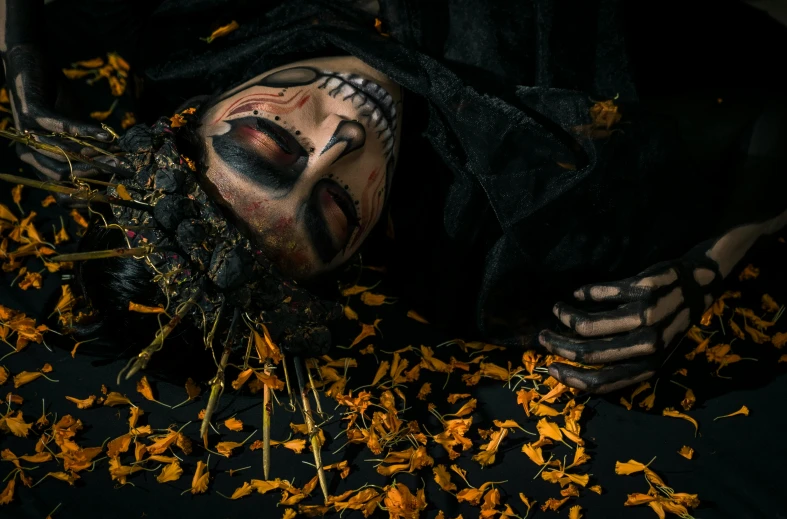 a close up of a person laying on a bed of flowers, inspired by Nicola Samori, pexels contest winner, vanitas, powerful male scarecrow, covered in leaves, avatar image, horror animatronic