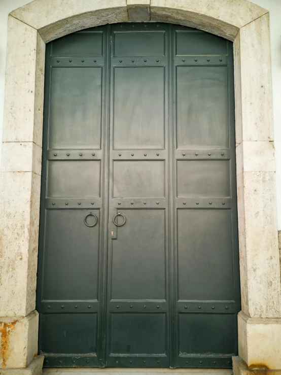 a close up of a door on a building, inspired by Károly Markó the Elder, unsplash, neoclassicism, square lines, nazare (portugal), grey metal body, wide view