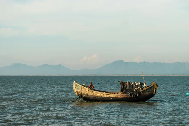 a small boat in the middle of a large body of water, unsplash contest winner, hurufiyya, in style of lam manh, profile image, thumbnail, assamese