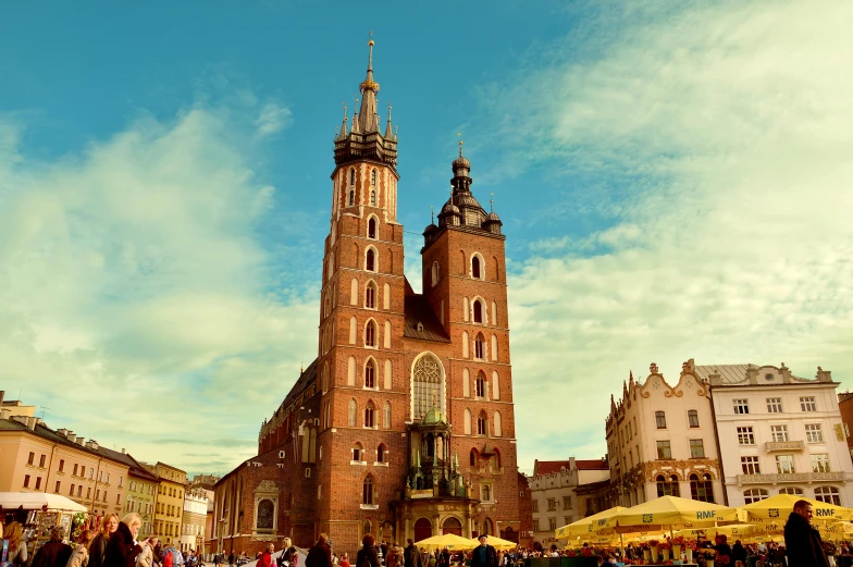 a group of people that are standing in front of a building, by Julia Pishtar, pexels contest winner, baroque, high towers, polish food, alabaster gothic cathedral, detailed color scan”