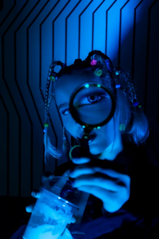 a woman looking through a magnifying glass, inspired by Bruce Munro, holography, blue neon details, rave girl, gen z, press shot