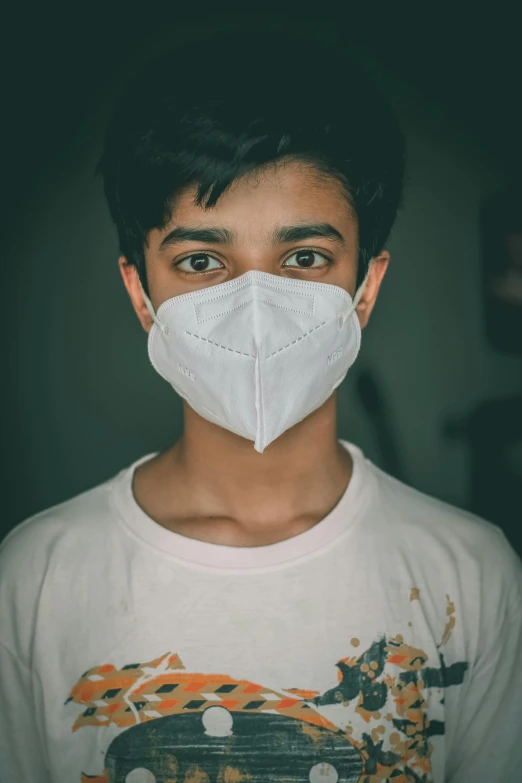 a young man wearing a white face mask, pexels, avatar image, ayan nag, made of plastic, 1 6 years old