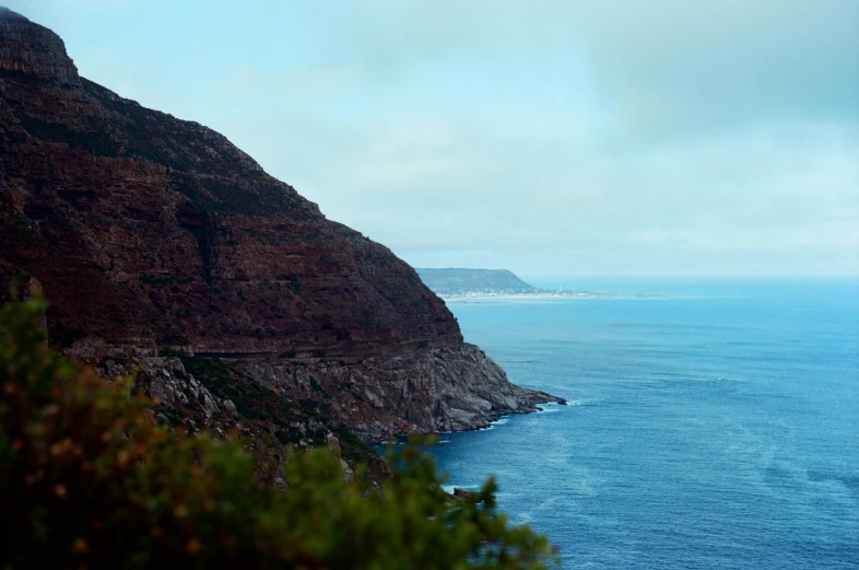 a view of the ocean from the top of a mountain, by Lee Loughridge, pexels contest winner, hurufiyya, cape, 2 5 6 x 2 5 6 pixels, brown, 200mm