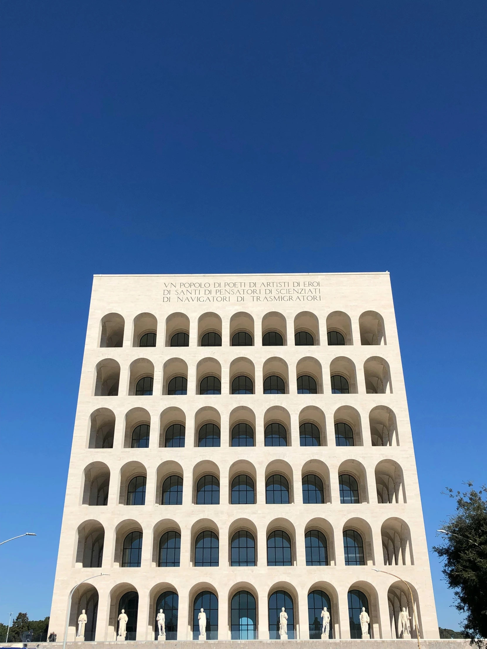 a large white building sitting on the side of a road, by Francesco Filippini, colosseo, fendi, official courthouse, profile image