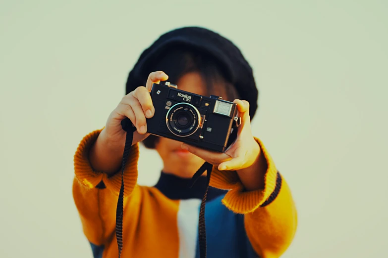 a person taking a picture with a camera, a picture, unsplash contest winner, kid, in retro colors, 4k photo”, pixvy