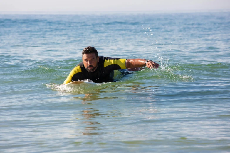 a man riding a wave on top of a surfboard, a picture, square, concern, thumbnail