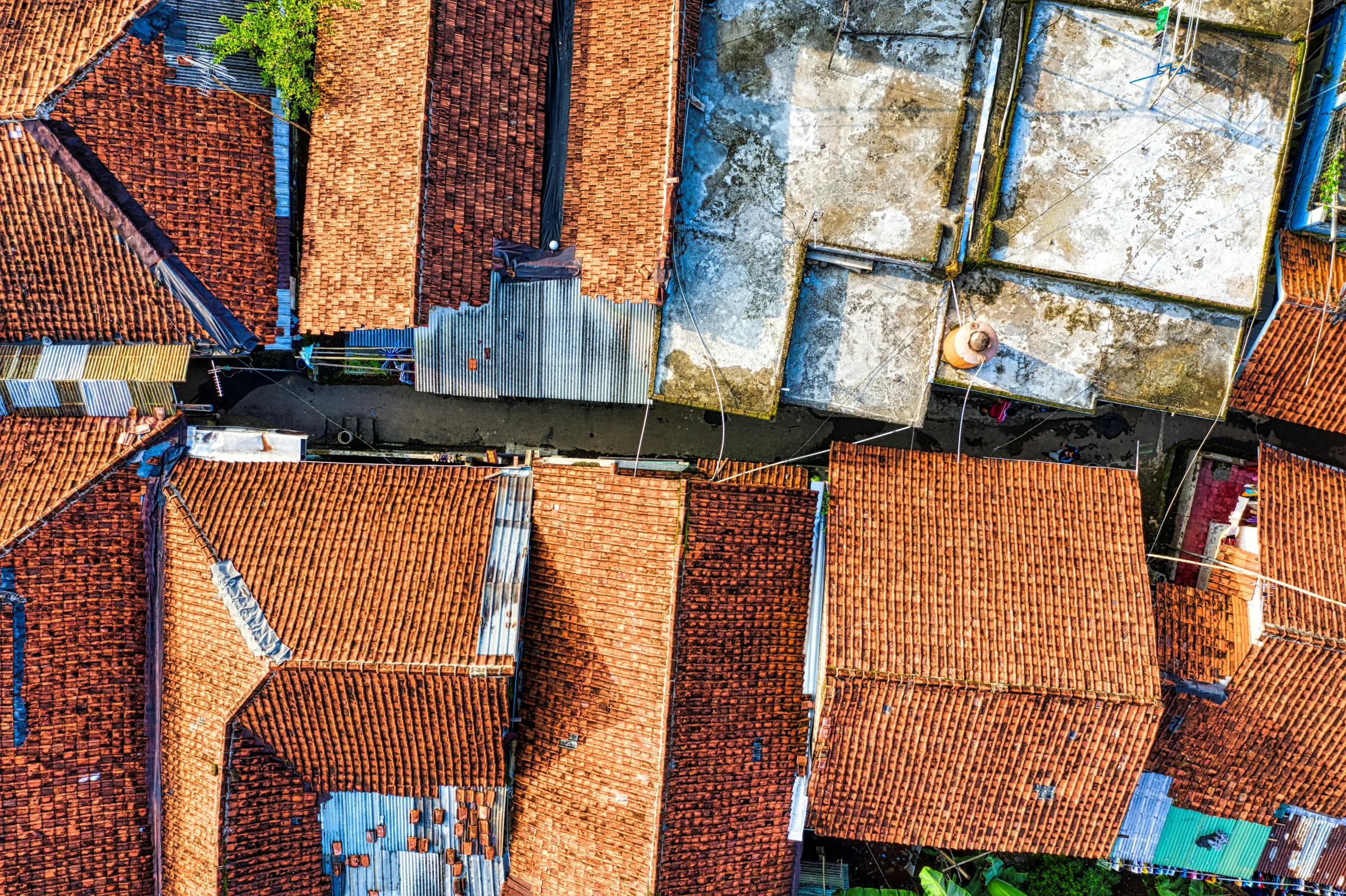 a bird's eye view of a group of rooftops, by Daniel Lieske, pexels contest winner, indonesia, background image, square, [ overhead view ]!