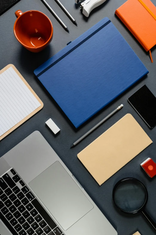 an open laptop computer sitting on top of a desk, trending on unsplash, academic art, 9 9 designs, knolling, dark blue + dark orange, square