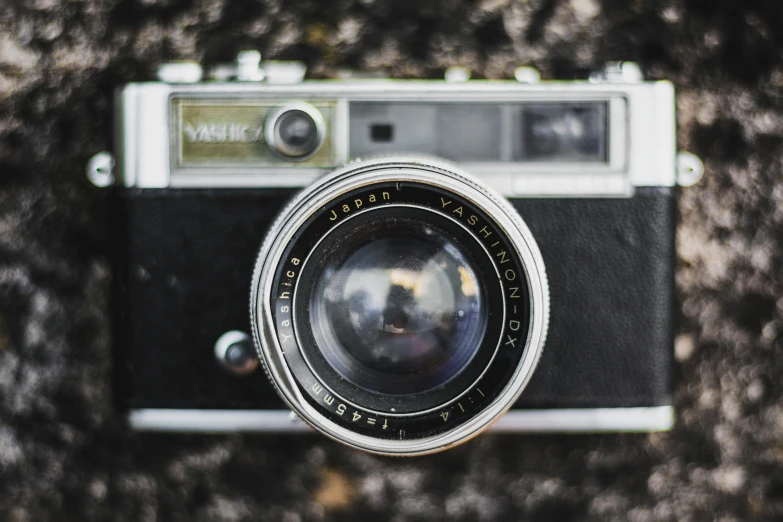 a black and white photo of a camera, a picture, inspired by Vivian Maier, unsplash contest winner, photorealism, coloured film photography, sepia photography, macro camera lens, instagram post
