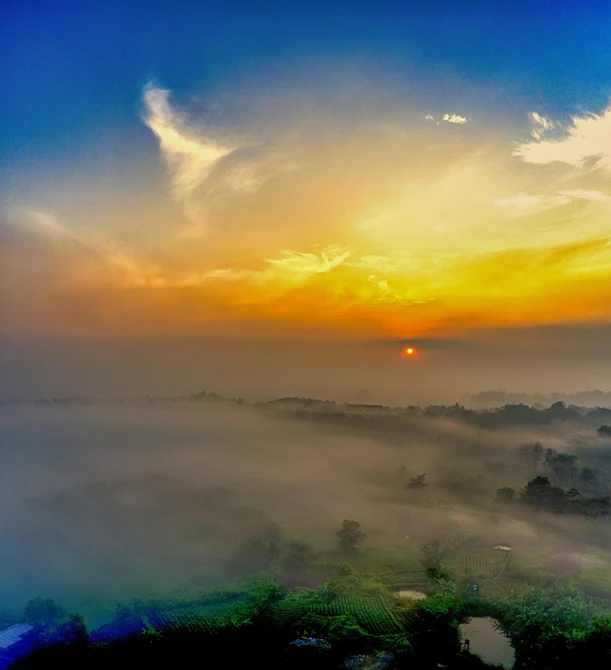 the sun is setting over a foggy valley, pexels contest winner, guwahati, bird\'s eye view, 8k hdr sunset lit, clean 4 k