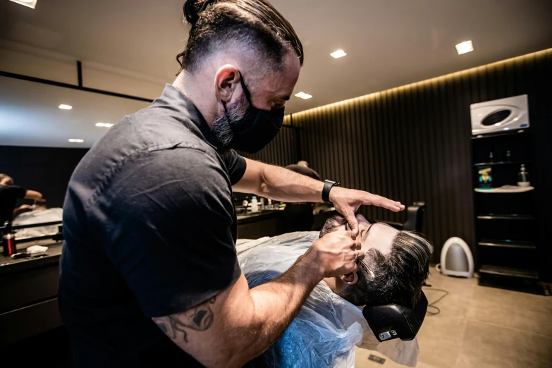 a man getting a haircut at a barber shop, a portrait, by Sam Black, pexels contest winner, renaissance, lachlan bailey, thumbnail, mask off, profile image