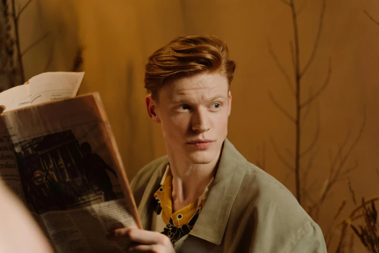 a man reading a newspaper in front of a mirror, by Emma Andijewska, trending on pexels, renaissance, ginger hair with freckles, julian ope, portrait tilda swinton, hunting
