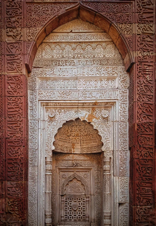 a close up of a doorway in a building, inspired by Li Di, arabesque, mausoleum ruins, intricate writing, red sandstone natural sculptures, mosque