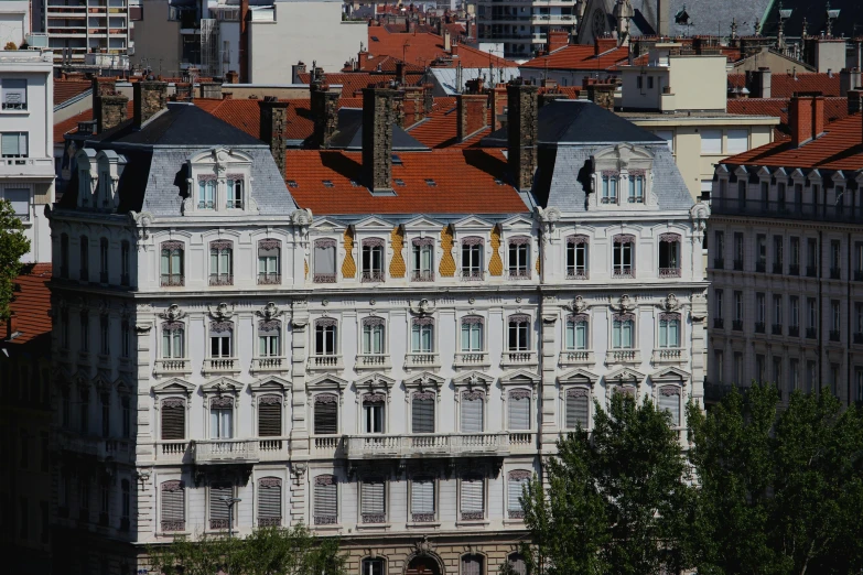 a large white building with a clock on top of it, a photo, by Bernard D’Andrea, pexels contest winner, art nouveau, panorama view, arkane lyon, crenellated balconies, ochre