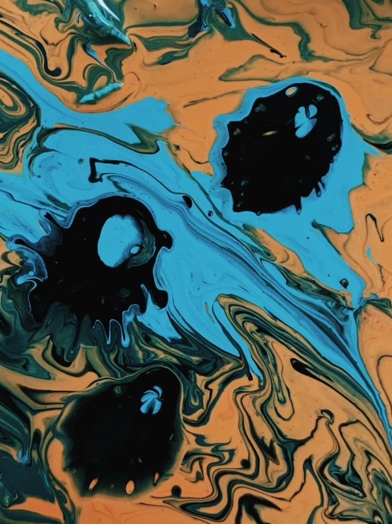 a close up of a painting on a table, an abstract drawing, inspired by Shōzō Shimamoto, reddit, made of ferrofluid, amber and blue color scheme, digital art - n 9, album cover