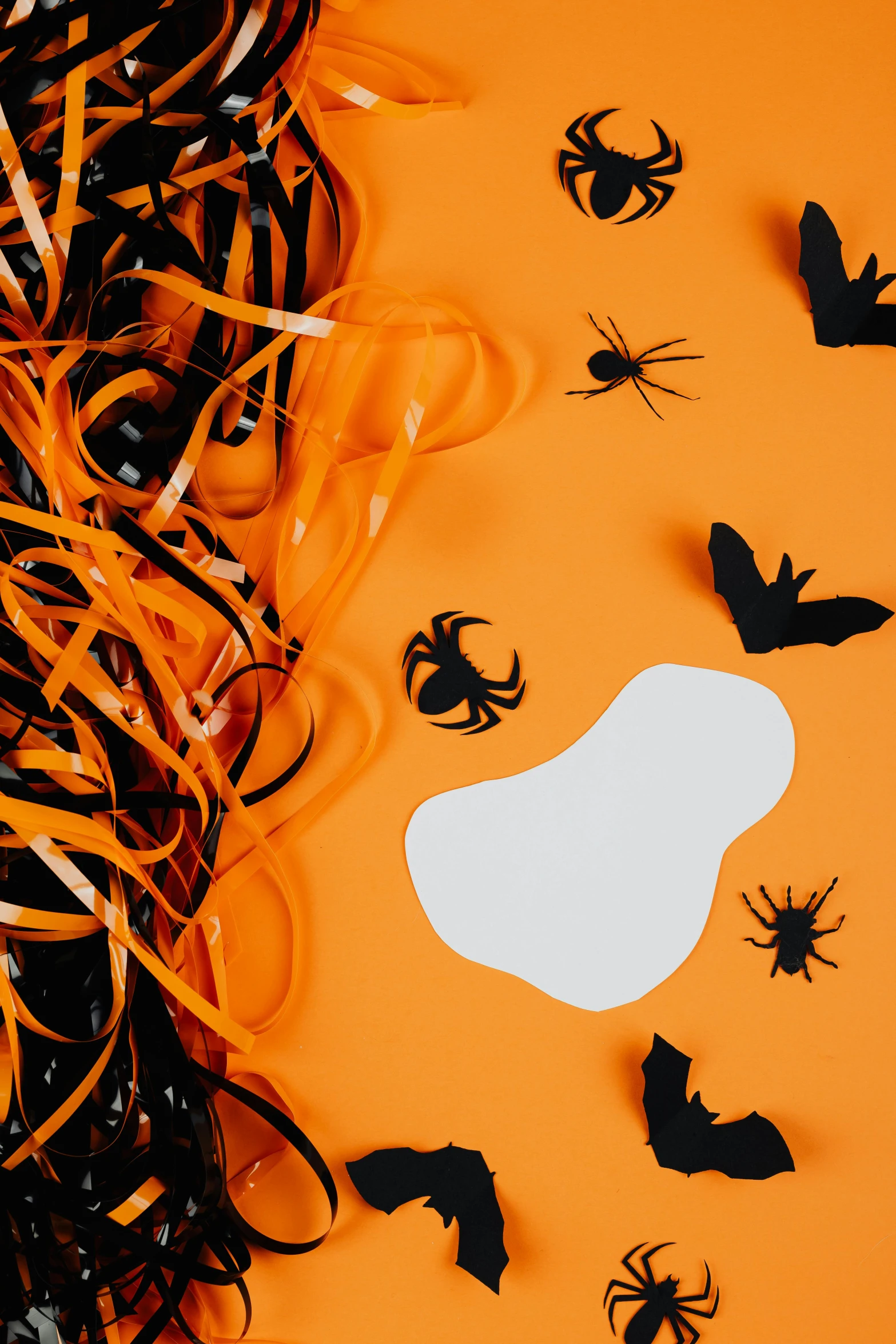 a bunch of halloween decorations on an orange background, by Julia Pishtar, conceptual art, veins popping out, paper cut out, with a white background, medium close shot