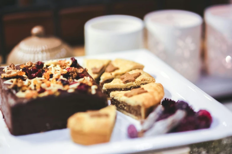 a close up of a plate of food on a table, pexels contest winner, hurufiyya, cakes, cozy, “the ultimate gigachad, brown