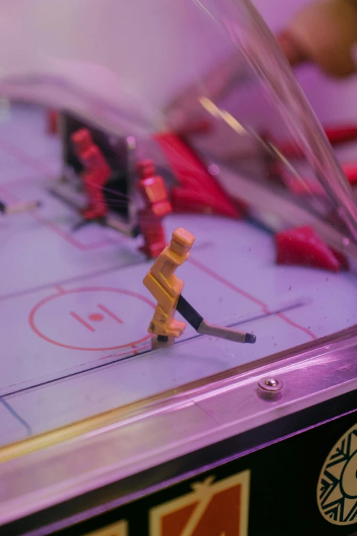 a close up of a game of foo foo foo foo foo foo foo foo foo foo foo, by Matt Cavotta, pexels, interactive art, nhl, mechanical features and neon, 1 9 7 9, miniature world