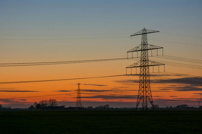 power lines in a field with a sunset in the background, by Jan Tengnagel, pexels contest winner, two giant towers, orange and green power, low detail, sunset panorama