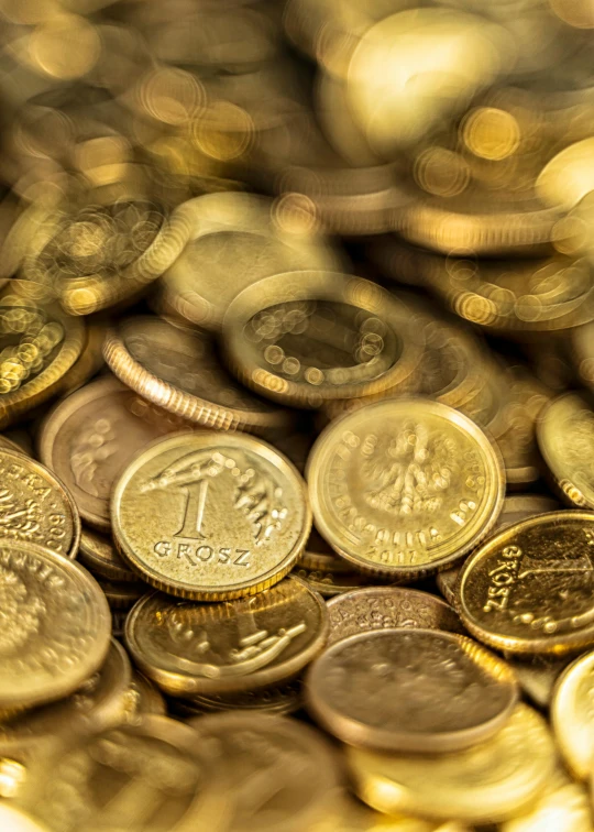 a pile of coins sitting on top of each other, by Adam Marczyński, pexels contest winner, renaissance, gold glow, israel, thumbnail, enhanced photo