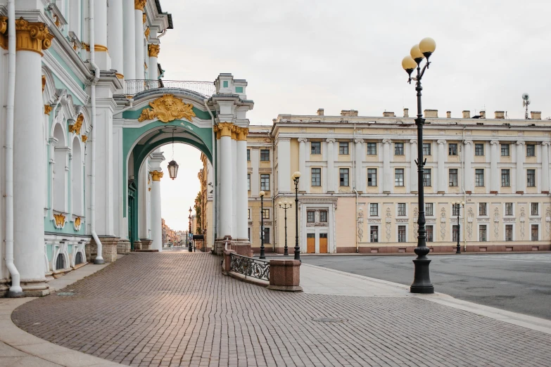 a red fire hydrant sitting on the side of a road, by Serhii Vasylkivsky, neoclassicism, giant majestic archways, all buildings on bridge, circular gate in a white wall, royal palace