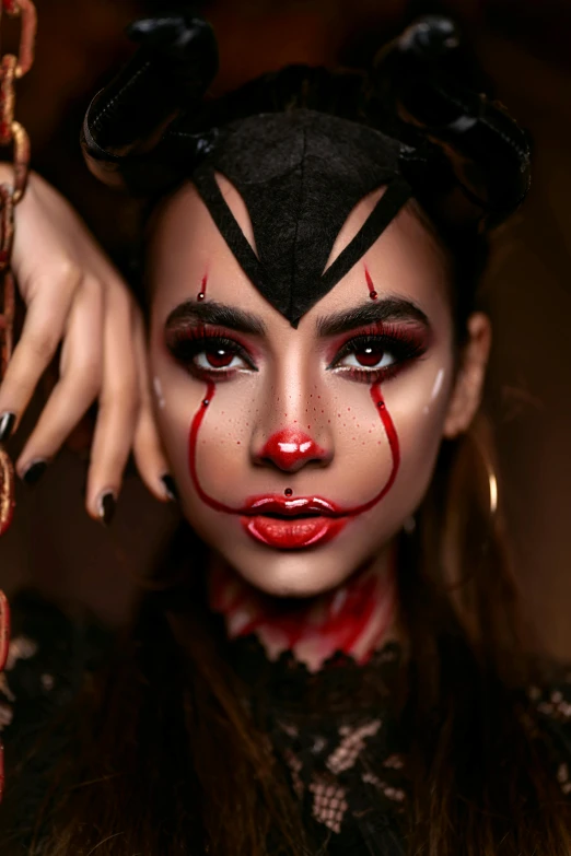 a close up of a person with makeup on, an album cover, inspired by Hedi Xandt, trending on pexels, gothic art, pennywise theme, tiefling from d & d, dark sorceress full view, makeup. unreal engine