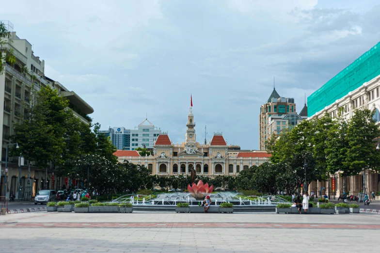 a large building with a fountain in front of it, inspired by Ruth Jên, pexels contest winner, vietnam, square, city panorama, profile image