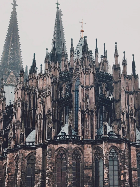 a very tall building with a clock on it's side, pexels contest winner, international gothic, 🎀 🗡 🍓 🧚, gothic cathedral, german romanticism style, black domes and spires