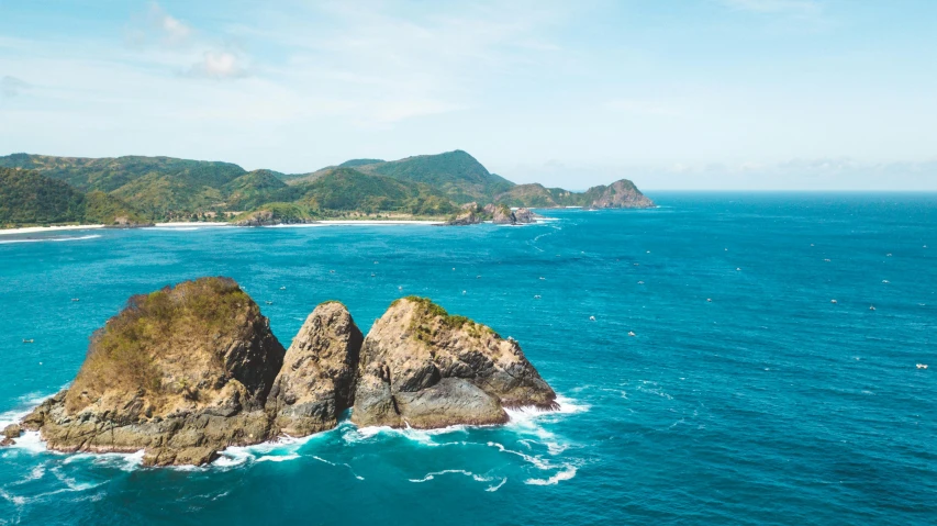 two large rocks in the middle of the ocean, pexels contest winner, renaissance, new zealand landscape, hills and ocean, wide high angle view, festivals