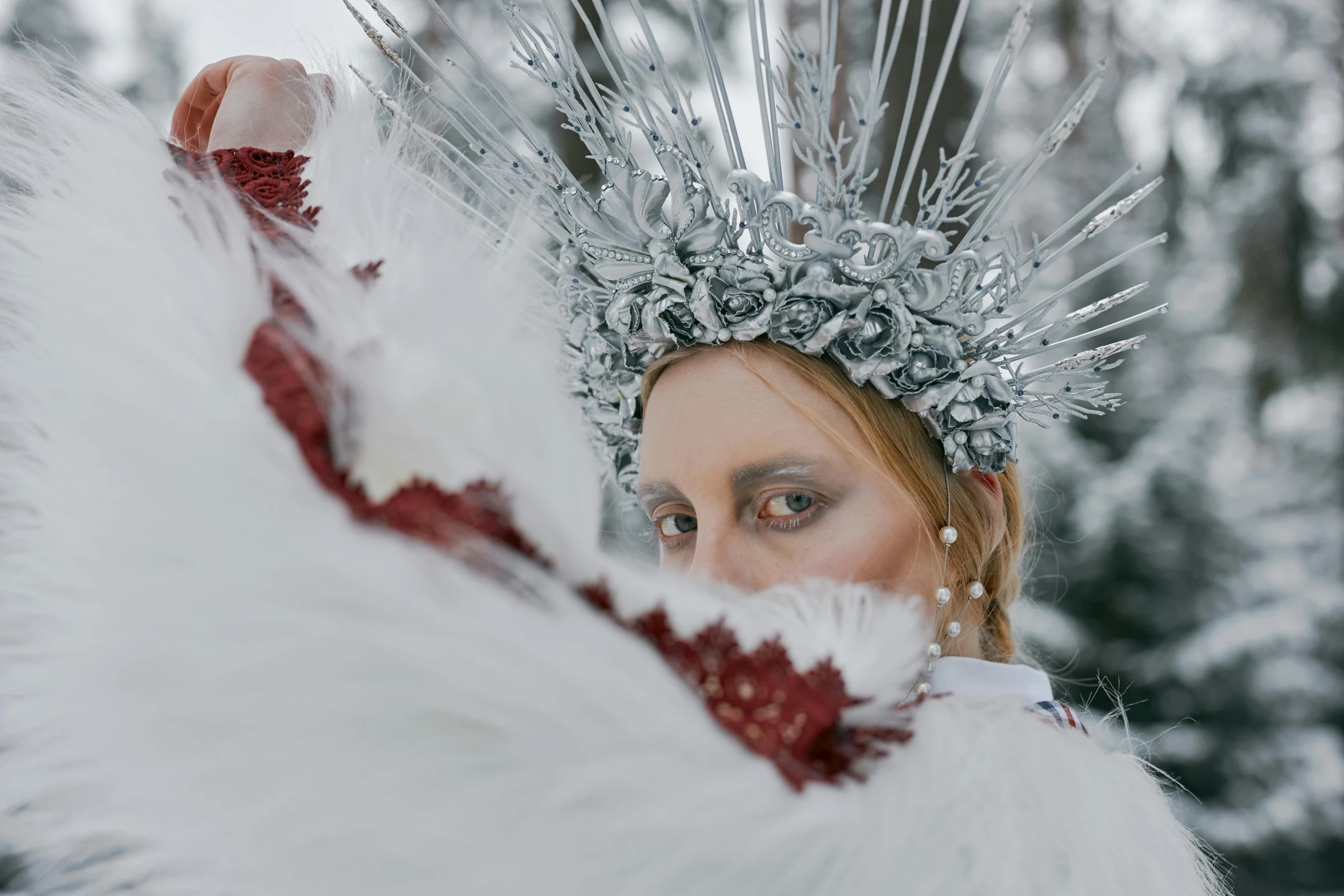 a woman wearing a silver and red costume, an album cover, inspired by Lucas Cranach the Elder, pexels contest winner, wearing ice crystals, white crown, white and silver, winter vibes