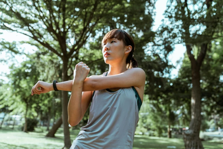 a woman holding a tennis racquet in a park, pexels contest winner, wearing a muscle tee shirt, pixeled stretching, asian woman, profile image