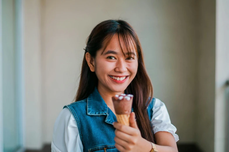 a woman holding an ice cream cone in her hand, pexels contest winner, smiling at camera, avatar image, patiphan sottiwilai, profile image