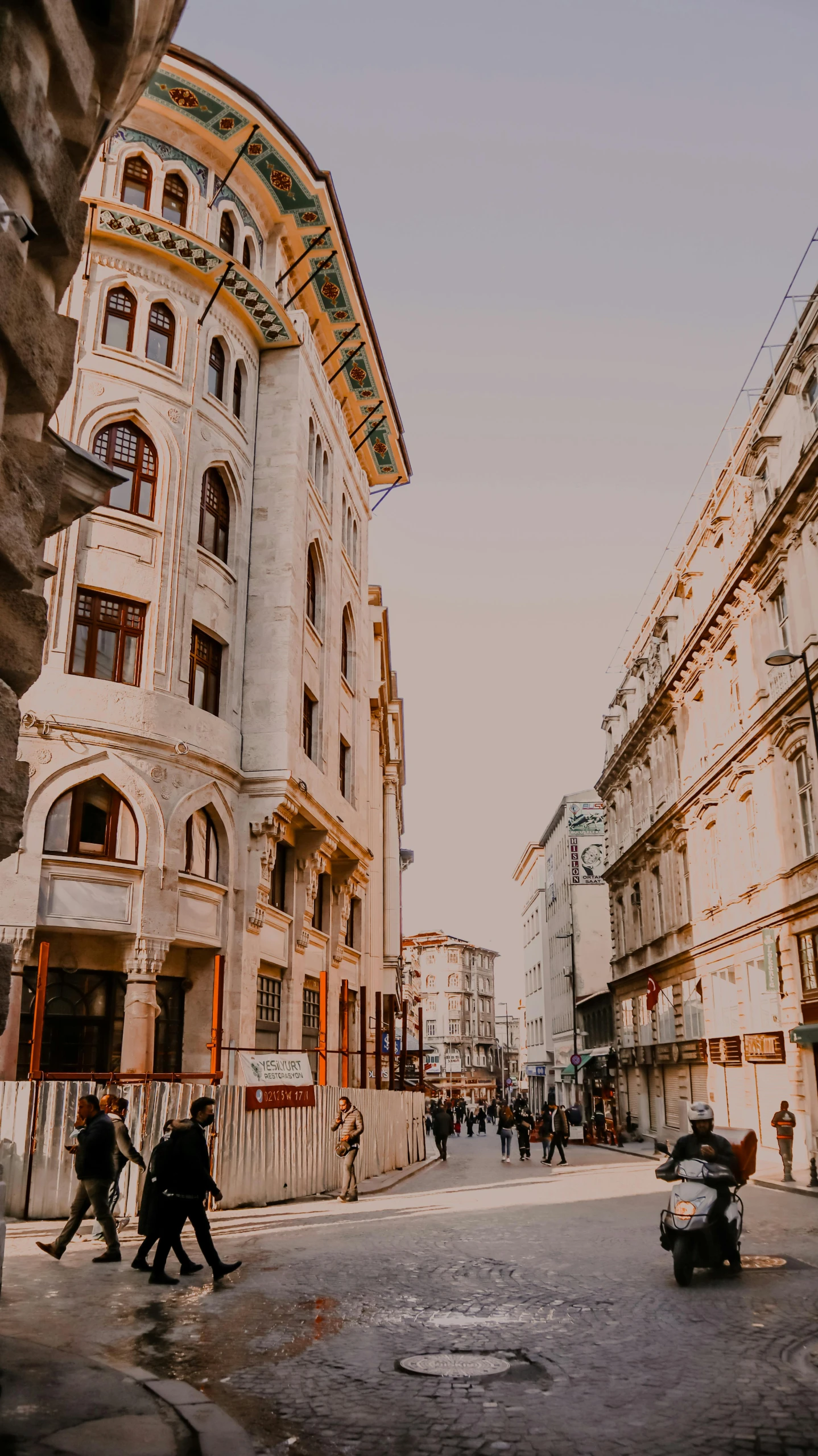 a group of people walking down a street next to tall buildings, unsplash contest winner, art nouveau, austrian architecture, beige, panorama view, neo - classical