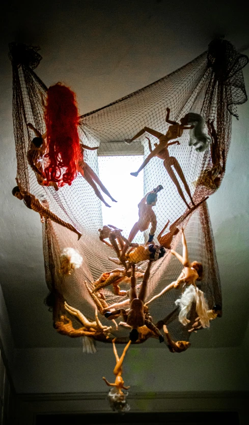 a group of skeletons hanging from a ceiling, net art, artdoll, spiritual scene, slide show, high view