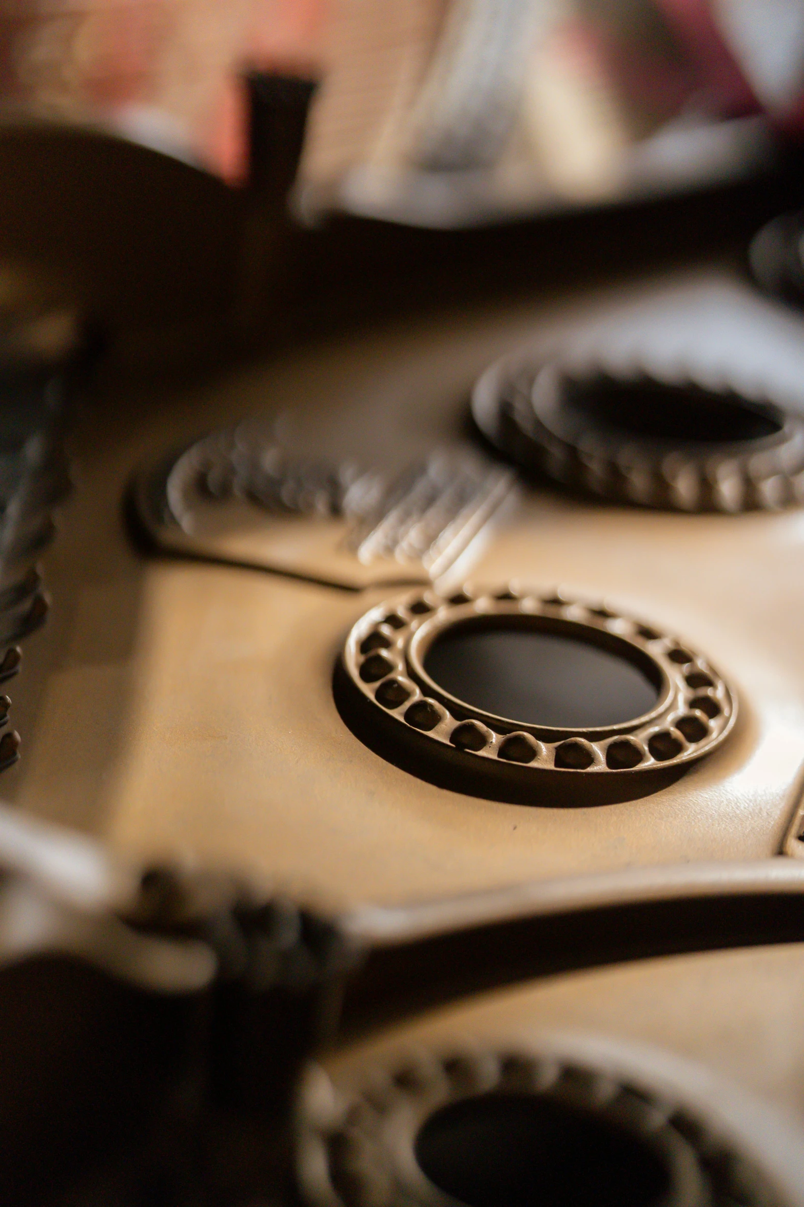 a close up of a close up of a piano, inspired by John Gibson, trending on polycount, assemblage, decorative leather armor, 4k polymer clay food photography, brown holes, studio medium format photograph