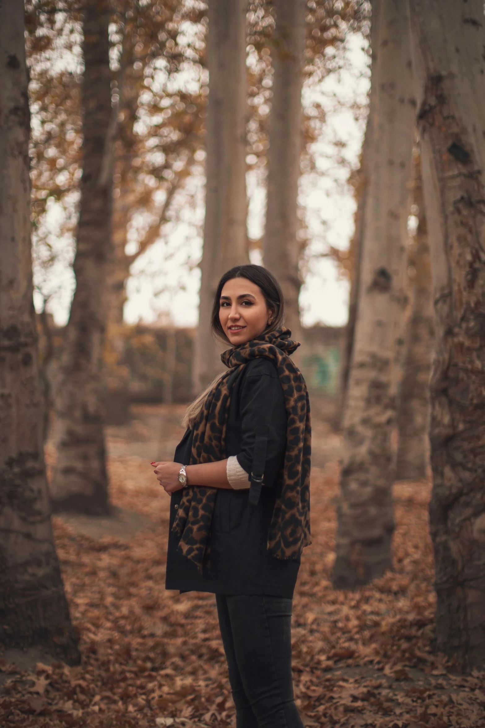 a woman standing in the middle of a forest, a portrait, inspired by Taravat Jalali Farahani, pexels contest winner, casual pose, in a city park, medium format. soft light, autum