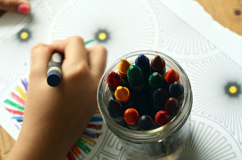 a person is drawing with crayons in a jar, a child's drawing, pexels contest winner, radial symmetry, colouring pages, thumbnail, enamel