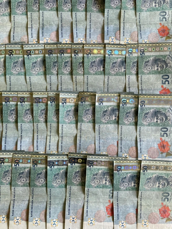 a pile of money sitting on top of a table, stereogram, kuala lumpur, highly detailed # no filter, 🤠 using a 🖥