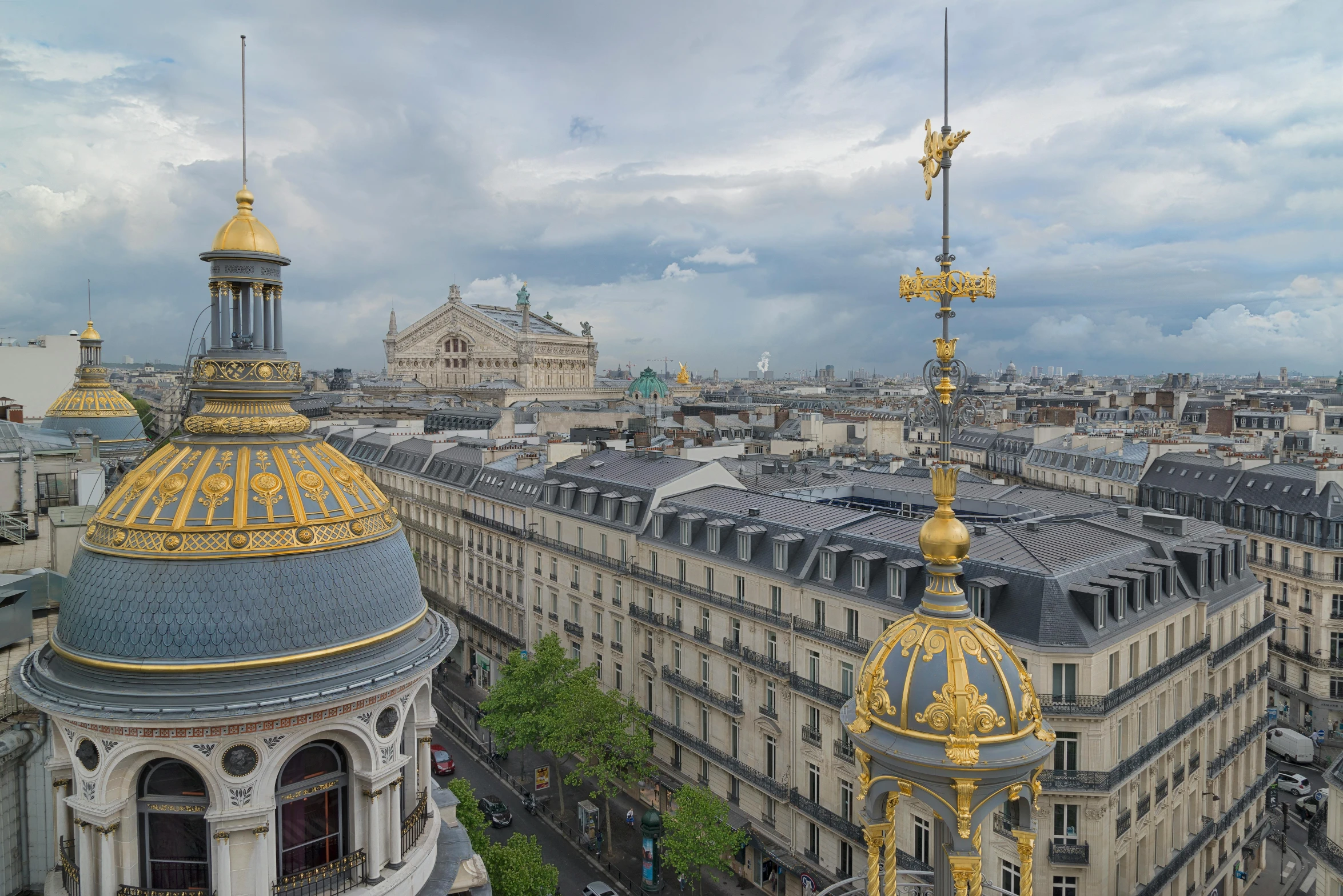 a view of a city from the top of a building, inspired by Édouard Detaille, unsplash contest winner, art nouveau, with great domes and arches, gilded with gold, herzog de meuron, exterior view