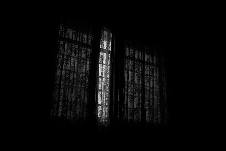 a black and white photo of a window in a dark room, inspired by Katia Chausheva, pexels, baroque, curtains, dim bedroom, isolated, house windows