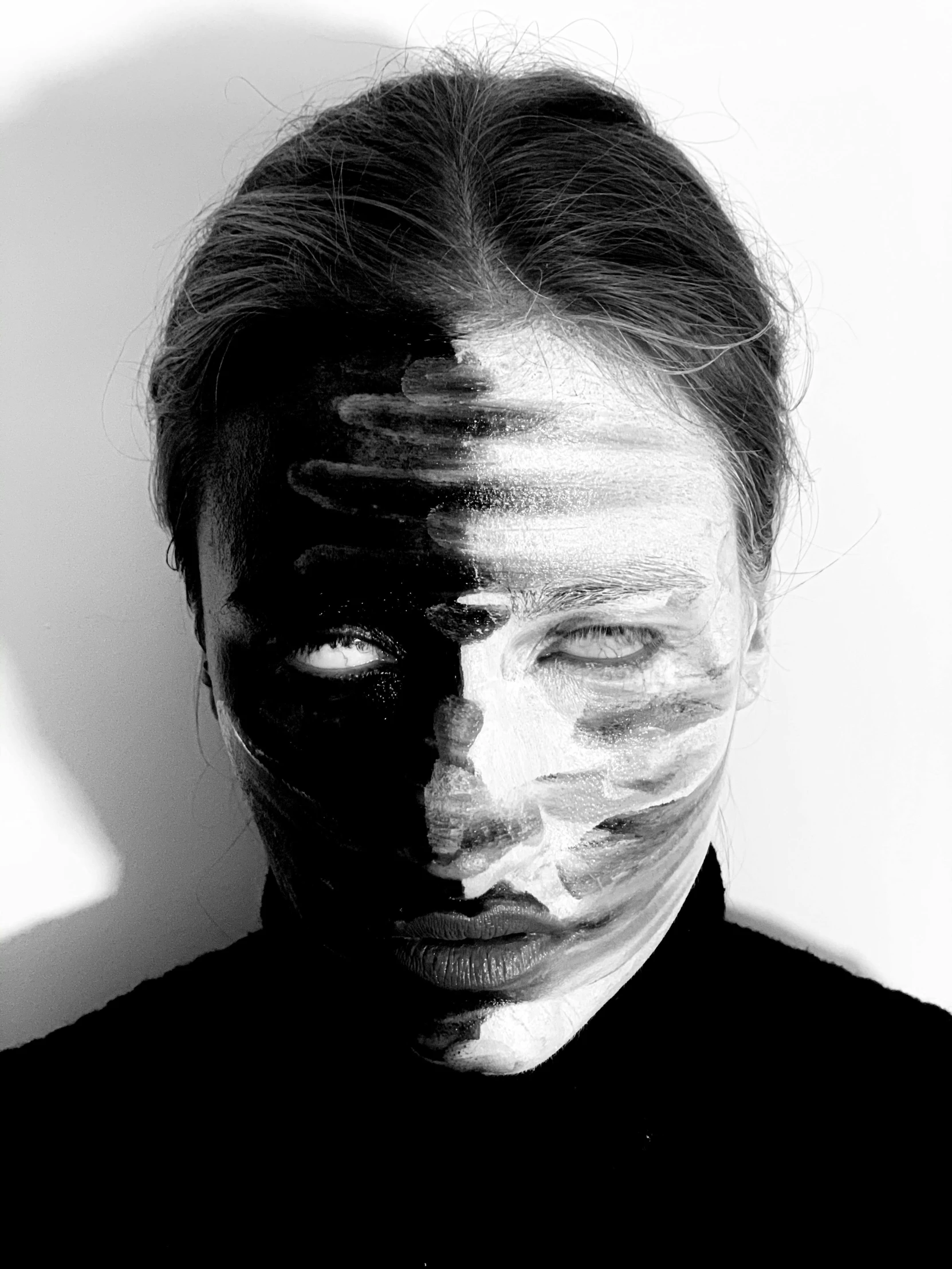 a black and white photo of a man's face, by Anna Füssli, surrealism, the mask covers her entire face, thom yorke lost, creative makeup, intimidating woman