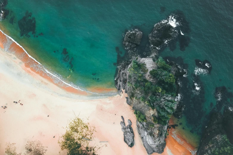 an aerial view of a sandy beach next to the ocean, pexels contest winner, green and red tones, detailed trees and cliffs, thumbnail, tropical undertones