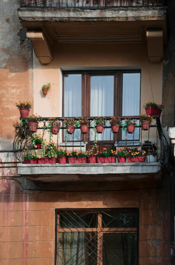 a bicycle parked in front of a building, on a balcony, flower pots, red and brown color scheme, naples