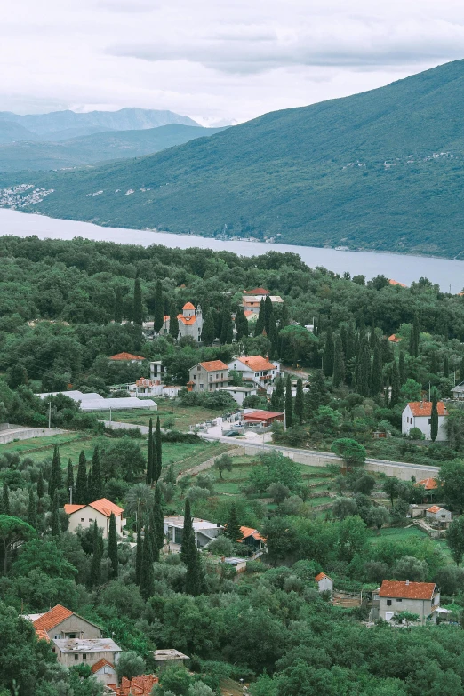 a bird's eye view of a small town in the mountains, boka, exterior botanical garden, lagoon, in 2 0 0 2