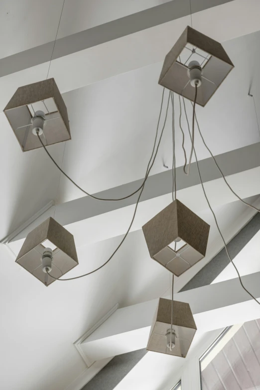 a bunch of boxes hanging from the ceiling, by Jan Tengnagel, light and space, featuring rhodium wires, concrete hitech interior, dynamic closeup, square