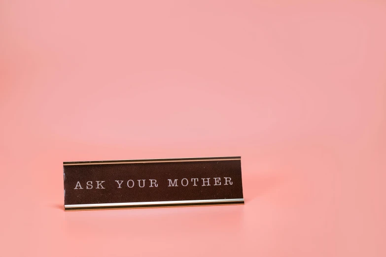 a pin with the words ask your mother on it, unsplash, panel of black, 9 0 mm studio photograph tiny, incense, pink