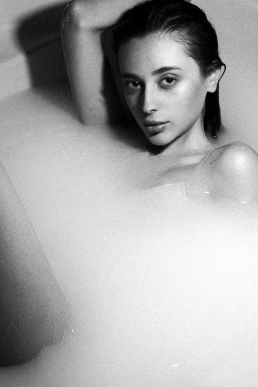 a black and white photo of a woman in a bathtub, inspired by George Hurrell, tumblr, process art, oona chaplin, square, jelly glow, model エリサヘス s from acquamodels